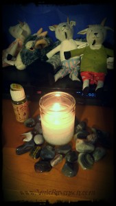Imbolc candle and some goat friends