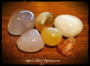 From top left: lithium quartz, citrine, pink calcite, rose quartz, orange calcite, sunstone